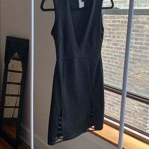 Black cocktail dress with cutouts & plunging neck